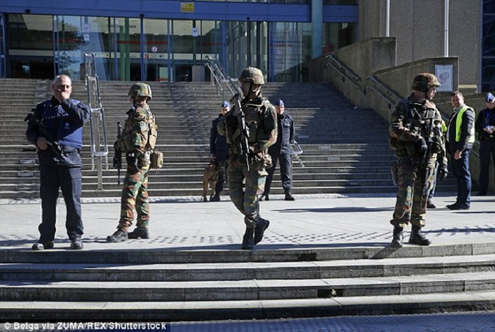 Belgian train station is evacuated `after two police officers are stabbed` 